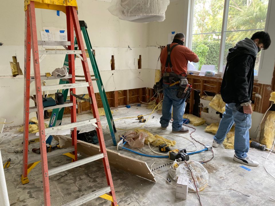 The demolition crew tears out our cabinets