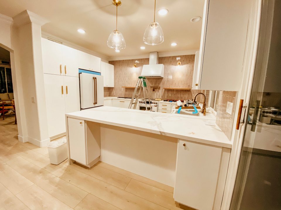 a mid-construction kitchen with the pendants all lit up!