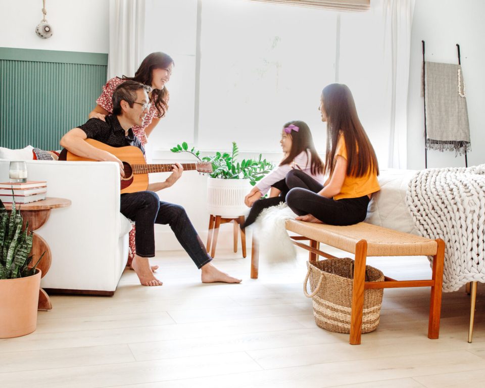 Travis plays guitar and sings to the girls