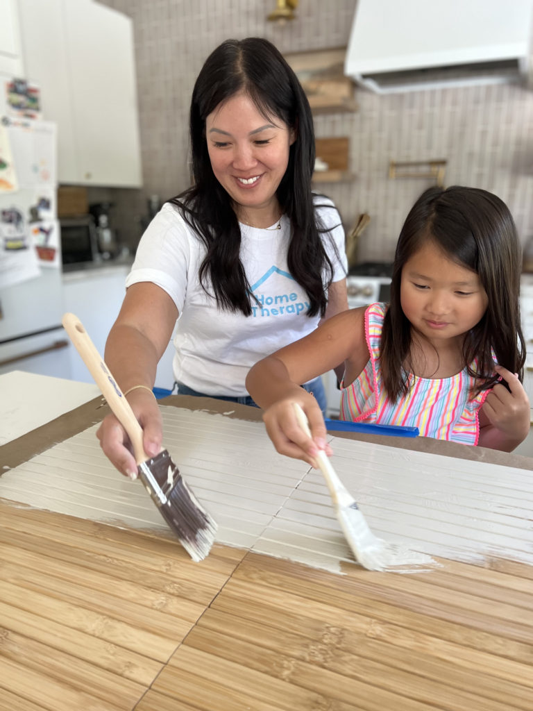 Anita and Natalie Paint the pieces for the side table