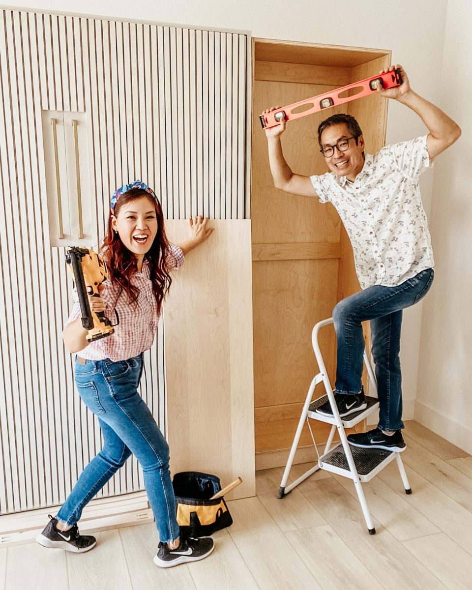 Travis on a stepladder and Anita holding power tools as the two take on an epic DIY! 