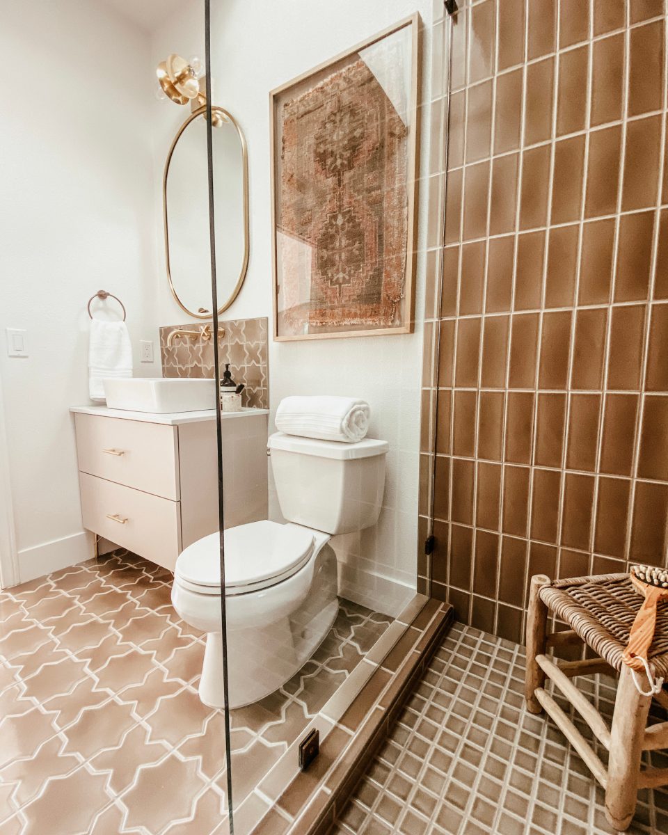 The view of the Desert Bathroom from the corner of the shower, with the stool visible in the corner