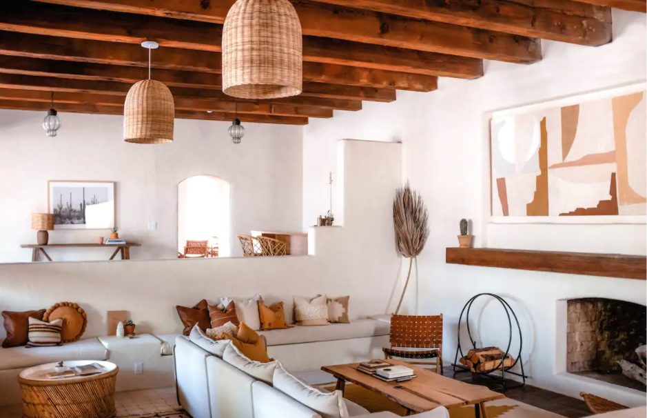 the light living room in the Ocotillo Suite, with wood beams and woven accents